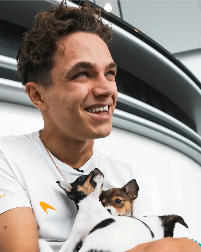 Nexter holding dog smiling